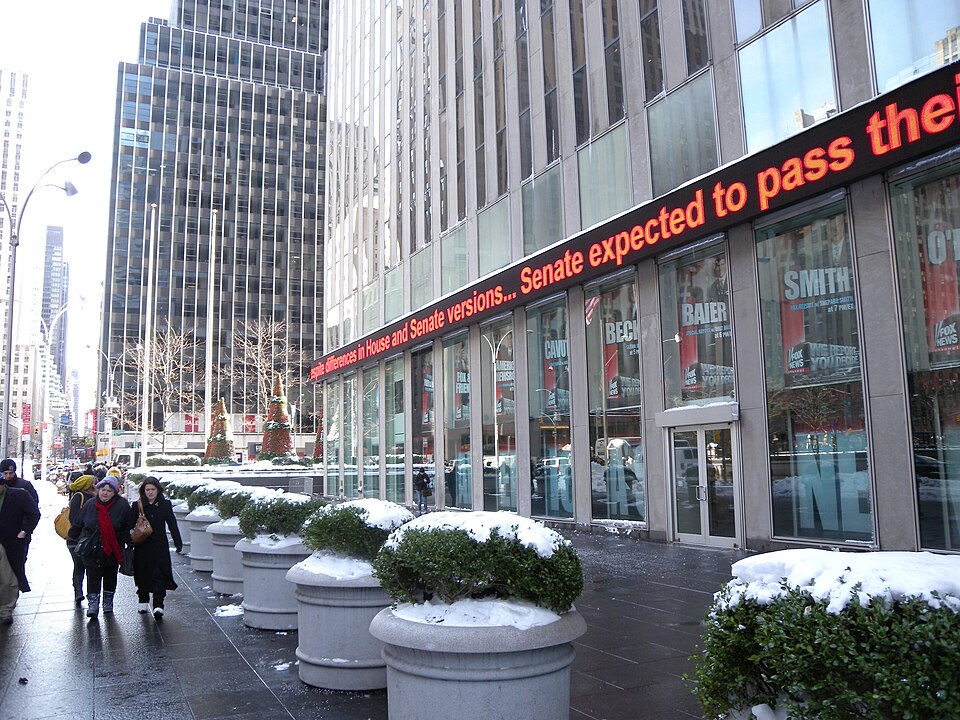 Looking east towards 6th Avenue along north (48th Street) side of Fox News building on a snowy afternoon.