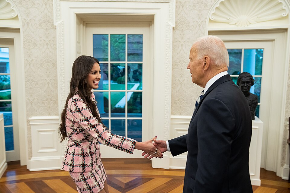 President Joe Biden greets singer Olivia Rodrigo on Wednesday, July 14, 2021, in the Oval Office of the White House. (Official White House Photo by Adam Schultz)