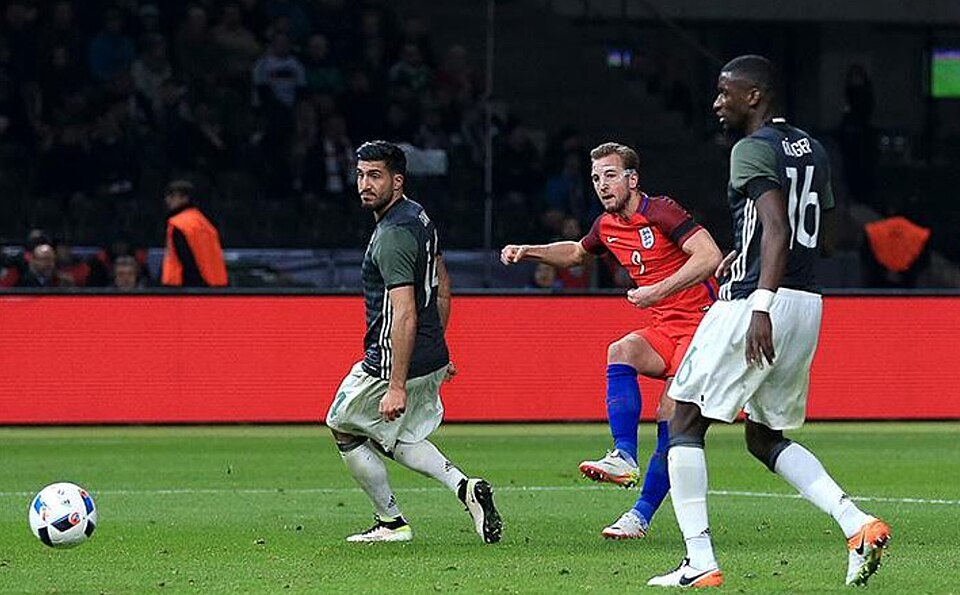 Harry Kane battles it out with the Germans