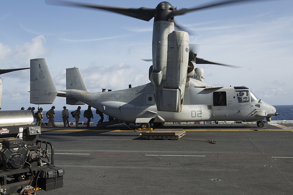 U.S. Marines and sailors with the 31st Marine Expeditionary Unit load into an MV-22B Osprey aboard the USS Bonhomme Richard (LHD 6), Aug. 8, 2015. The 31st MEU is staging Ospreys in Guam in support of typhoon recovery efforts in Saipan. The aircraft will be on standby in the event their aerial lift