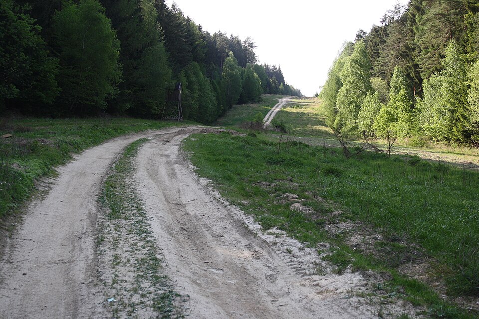 Forest path with underground petroleum pipeline Družba in the Czech Republic.