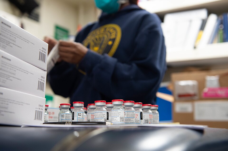 210213-N-WQ732-1067 NORFOLK, Virginia (Feb. 13, 2021) – Hospital Corpsman Petty Officer 2nd Class Terrell Senette prepares the COVID-19 vaccine to administer to the crew of Ticonderoga-class guided-missile cruiser USS Monterey (CG 61), Feb. 13, 2021.  Monterey is currently pier side at Naval Station