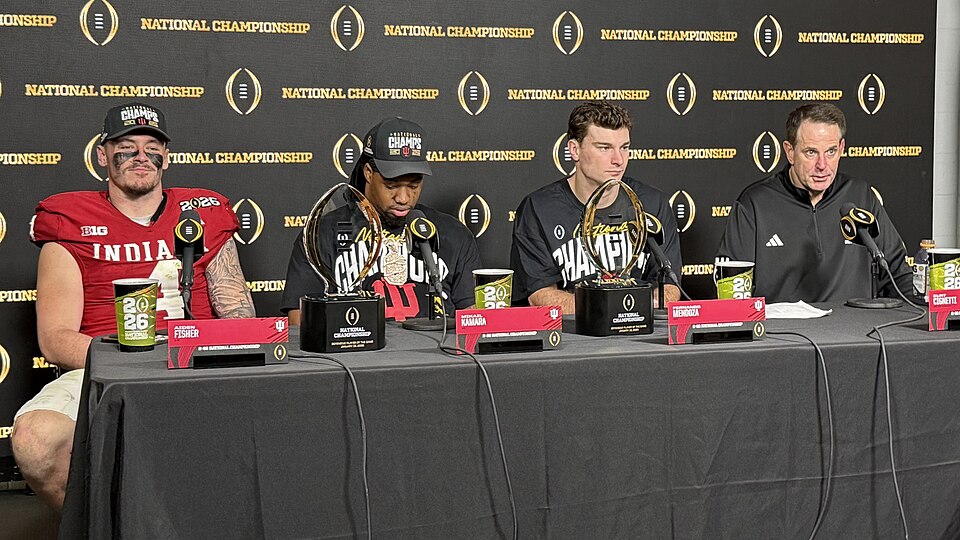 From left to right: Indiana Hoosiers linebacker Aiden Fisher, defensive end Mikail Kamara (CFP Defensive Player of the Game), quarterback Fernando Mendoza (CFP Offensive Player of the Game), and head coach Curt Cignetti at the post-game press conference in Hard Rock Stadium after the 2026 College Fo