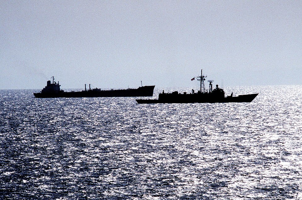 The guided missile frigate USS RENTZ (FFG-46) escorts the transport oiler USS SEALIFT CHINA SEA (T-AOT-170) in the Strait of Hormuz.