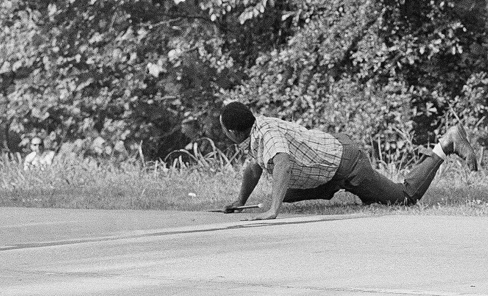 Civil rights activist James Meredith (then 32) lies on the ground after having been shot thrice while walking in his March Against Fear in Mississippi. The gunman, Aubrey James Norvell (40), is seen in the bushes on the left. This photograph won the 1967 Pulitzer Prize for Photography.