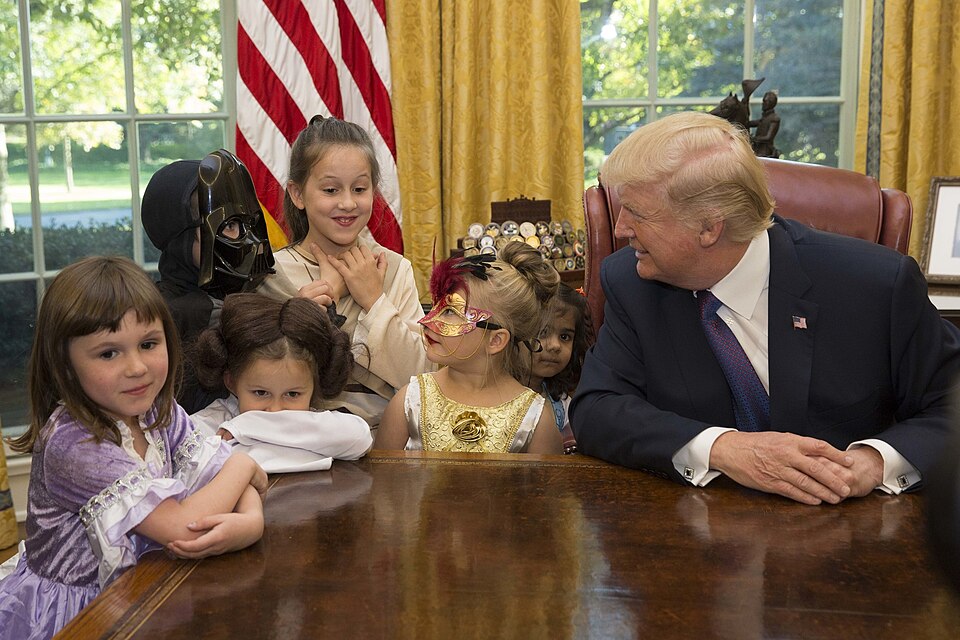 President Donald J. Trump welcomes Halloween trick-or-treaters to the Oval Office, Friday, October 27, 2017, at the White House in Washington, D.C. (Official White House Photo by Joyce N. Boghosian)
