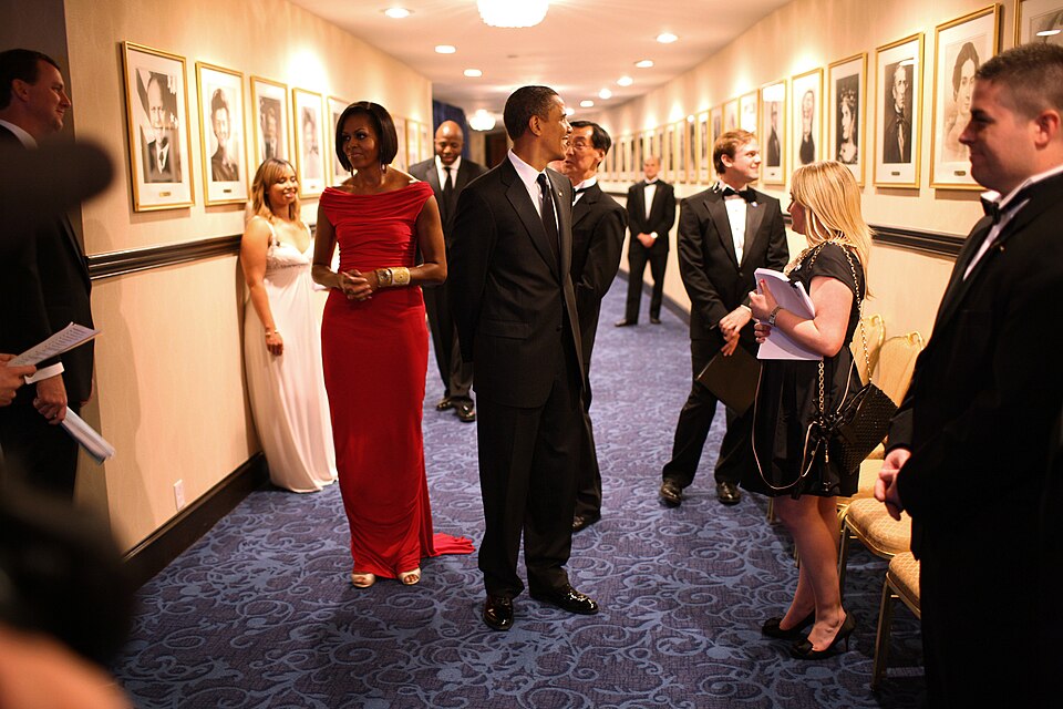 President Barack Obama and First Lady Michelle Obama wait in a hallway at the Washington Hilton Hotel in Washington, D.C., moments before taking the stage at the White House Correspondents Association dinner, Saturday, May 1, 2010. (Official White House Photo by Lawrence Jackson) Michelle Obama wear