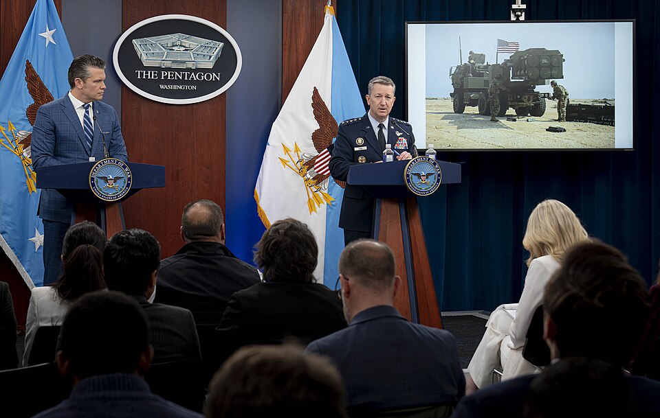 Chairman of the Joint Chiefs of Staff Gen. Dan Caine, alongside Secretary of Defense Pete Hegseth, holds a press briefing at the Pentagon in Arlington, Virginia, April 8, 2026. The U.S. and Iran agreed to a 2-week ceasefire on April 7, 2026, pausing combat operations during Operation Epic Fury. (DoW