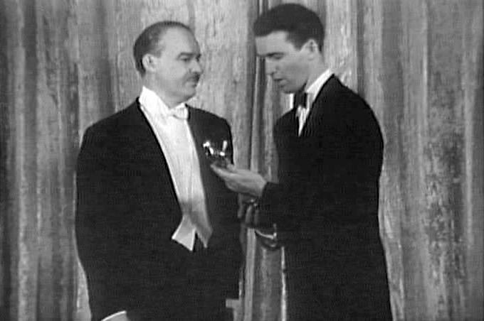 Screenshot of a Universal Newsreel showing James Stewart receiving an Oscar in 1941.
The newsreel can be found here, archive.org lists it as being in Public Domain.

This page contains more information, most particulary: "Universal City Studios gifted Universal Newsreel to the American people, put t