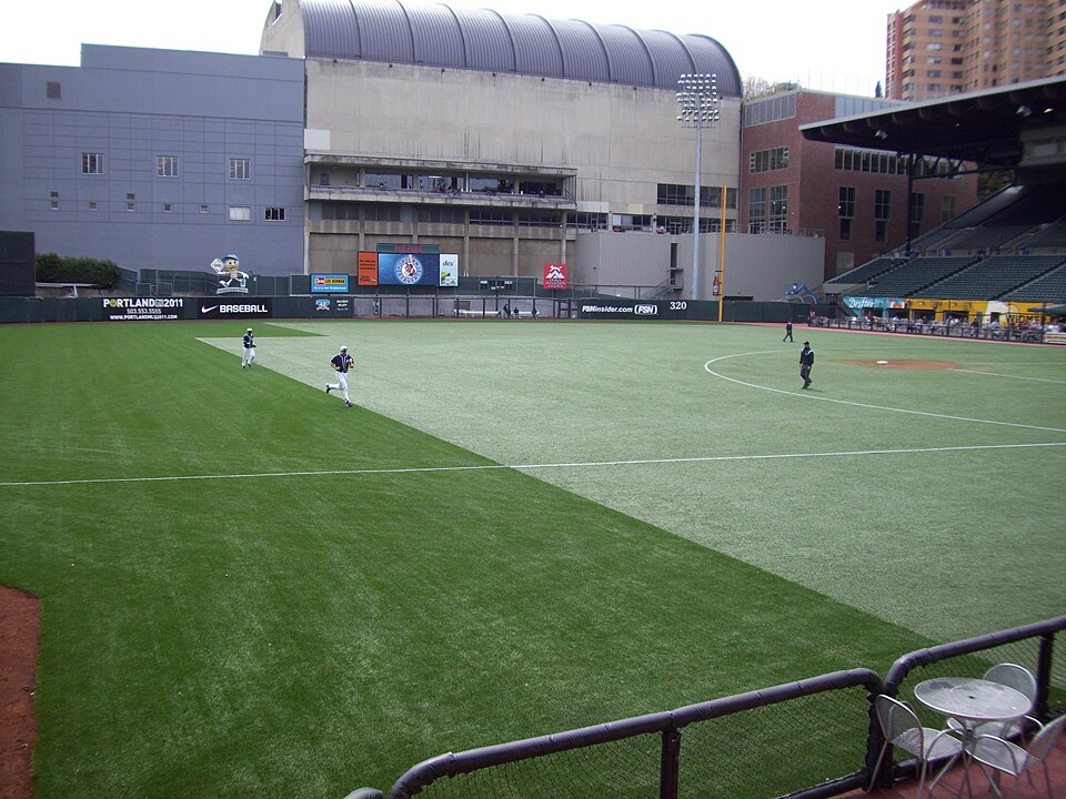 Center and right field in PGE Park. The field is a two-toned artificial turf. The Multnomah Athletic Club can be seen behind right field.