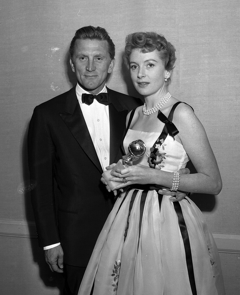 Golden Globe Winners Kirk Douglas and Deborah Kerr posing for pictures at the awards ceremony held at the Ambassador Hotel in Los Angeles.