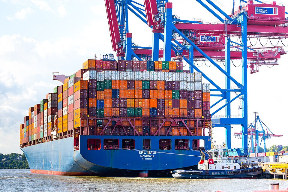 Container ship SFL Maui - IMO 9635688 - moored at Container Terminal Burchardkai Hamburg. With tug boat VB Perfect - IMO 9684756