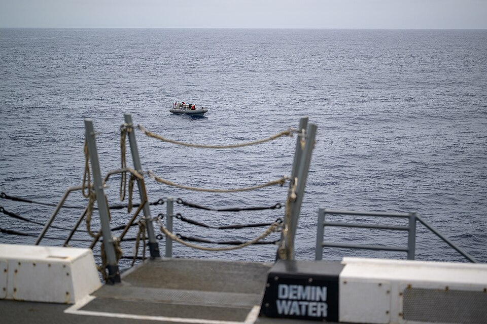A support boat is seen along side USS John P. Murtha as teams prepare for the return of the Artemis II crewmembers to Earth, Thursday, April 9, 2026, in the Pacific Ocean off the coast of California. NASA’s Artemis II mission is taking NASA astronauts Reid Wiseman, commander; Victor Glover, pilot; C