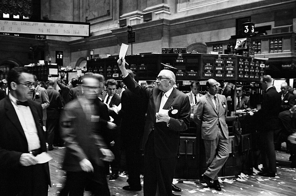 Photograph shows stock brokers working at the New York Stock Exchange