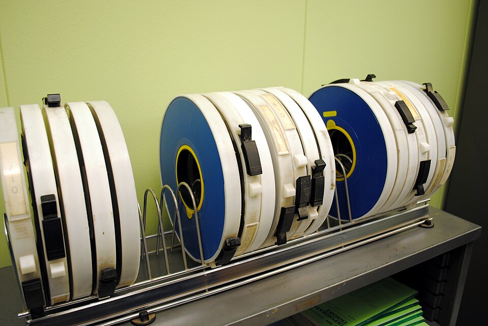 These are tapes for the SDS Sigma 7 computer used by the UCLA Boelter 3420 lab, the birthplace of the Internet.  The Sigma-7 used the Interface Message Processor to transmit messages (we call them "packets" today) to other IMPs and systems connected to the ARPANET.  UCLA's Sigma-7 and IMP form the f