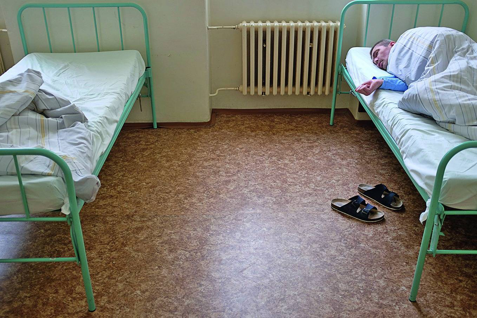 A patient sleeping in Ward 14 of the Bohnice Psychiatric Hospital in Prague