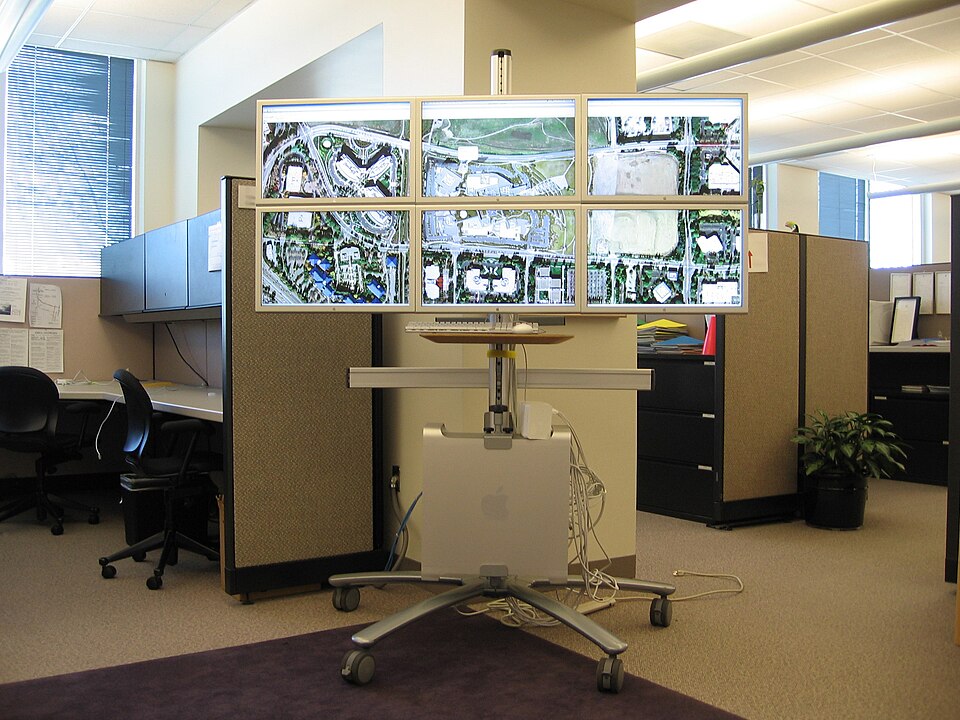 View of the whole cart.  That's a Mac Pro with 4 3.0GHz cores, 8GB RAM, one ATI X1950, two Nvidia 7300GT's, and six 23" Apple Cinema Displays.  The cart is made by Bretford.