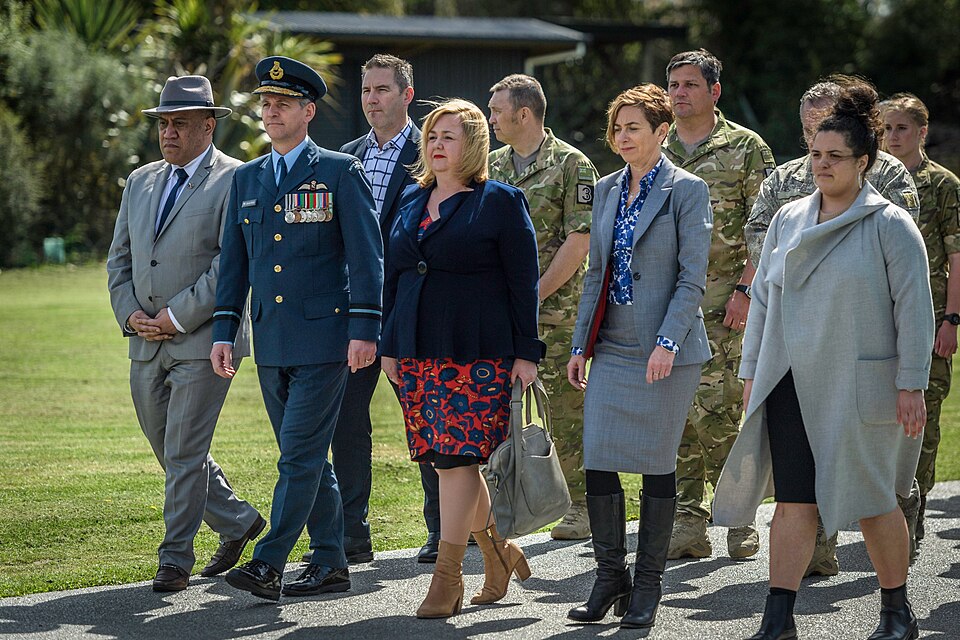 Hon Dr Megan Woods and Air Commodore Darryn Webb with Managed Isolation and Quarantine Facility personel at Tuahiwi Marae.