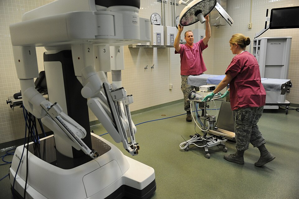 Lt. Col. (Dr.) Thomas Shaak , 81st Medical Support Squadron clinical research laboratory director, and Staff Sgt. Mandy Polen, 81st MDSS clinical research laboratory NCO in charge, prepare a table site for robotic surgical training at the Clinical Research Laboratory Oct. 21, 2016, on Keesler Air Fo