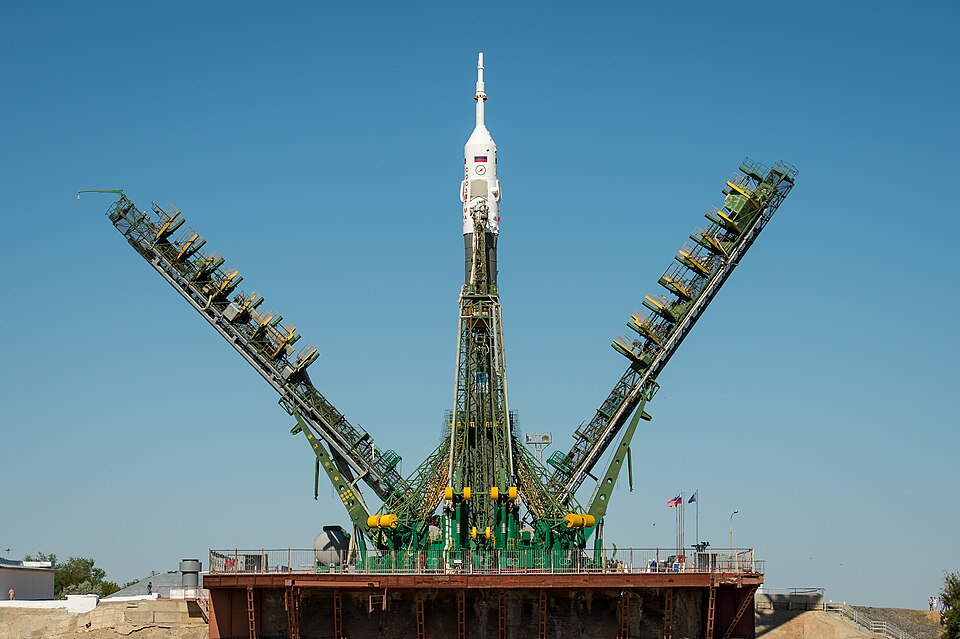 The Service arms are raised into position around the Soyuz rocket, with the TMA-09M spacecraft, after arriving at the Baikonur Cosmodrome launch pad by train, Sunday, May 26, 2013, in Kazakhstan. The launch of the Soyuz rocket to the International Space Station (ISS) with Expedition 36/37 Soyuz Comm