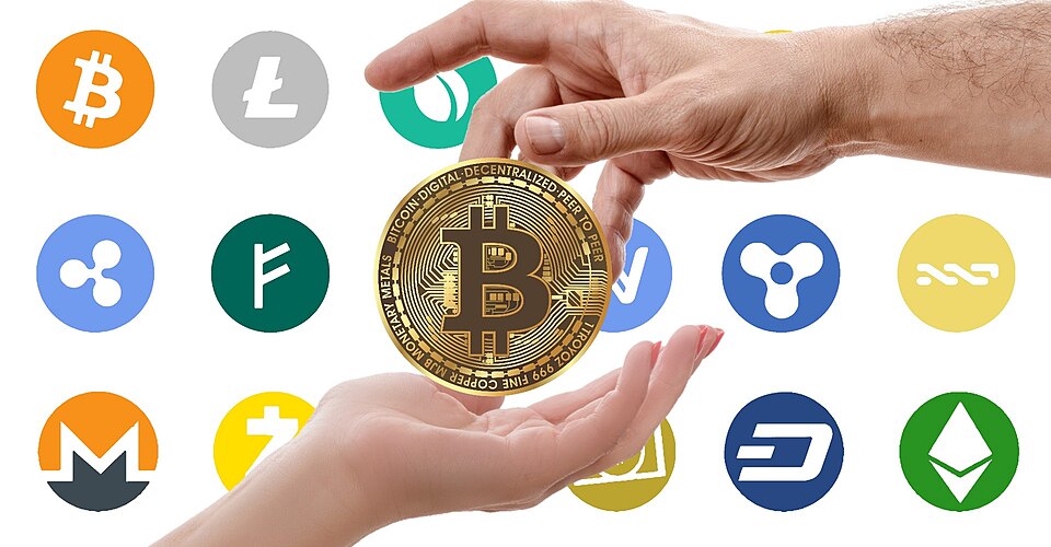 Various different crypto currencies logos. The bitcoin logo in the middle displays two hands, one hand is giving and one hand is receiving, and it is a metaphor for the exchanging of bitcoin.