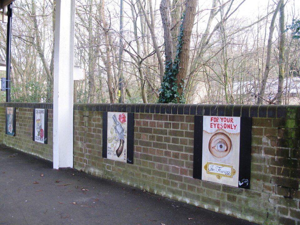 The westbound platform at Sherborne station in Dorset, England, features a display of James Bond artwork. The ones nearest the camera are From Russia With Love and For Your Eyes Only.