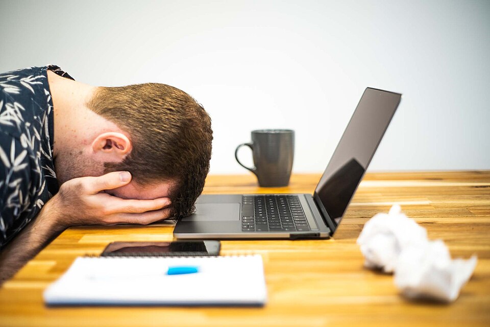 A photograph depicting occupational burnout. Photo was created by Micro Biz Mag for use in a post on the topic of burnout. We release this now freely under Creative Commons Licensing with a request that any usage is attributed with a link to the source at www.microbizmag.co.uk/burnout-statistics-uk/