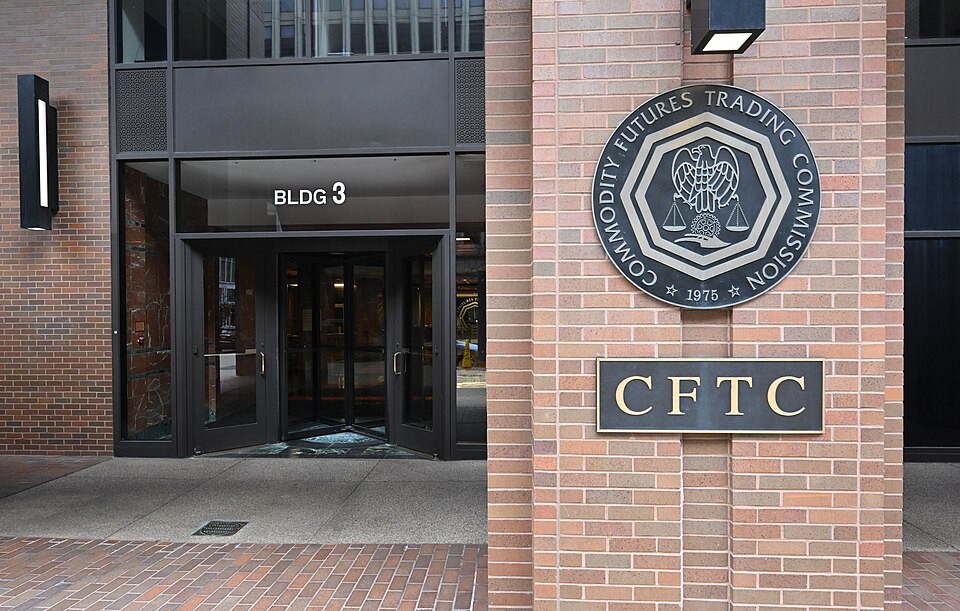 The logo and the entrance to the Commodity Futures Trading Commission (CFTC). Three Lafayette Center, 1155 21st Street NW, Washington, DC 20581.