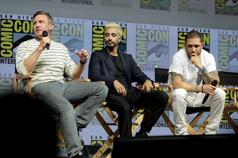 Ruben Fleischer, Riz Ahmed and Tom Hardy speaking at the 2018 San Diego Comic Con International, for "Venom", at the San Diego Convention Center in San Diego, California.

Please attribute to Gage Skidmore if used elsewhere.