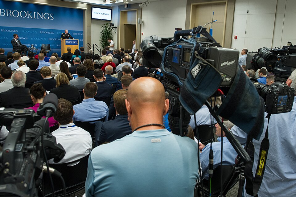 Chairman of the Joint Chiefs of Staff U.S. Army Gen. Martin E. Dempsey, background, at lectern, hosts a question and answer session after delivering remarks at the Brookings Institution in Washington, D.C., June 27, 2013. Dempsey discussed the military's role in cyber security.