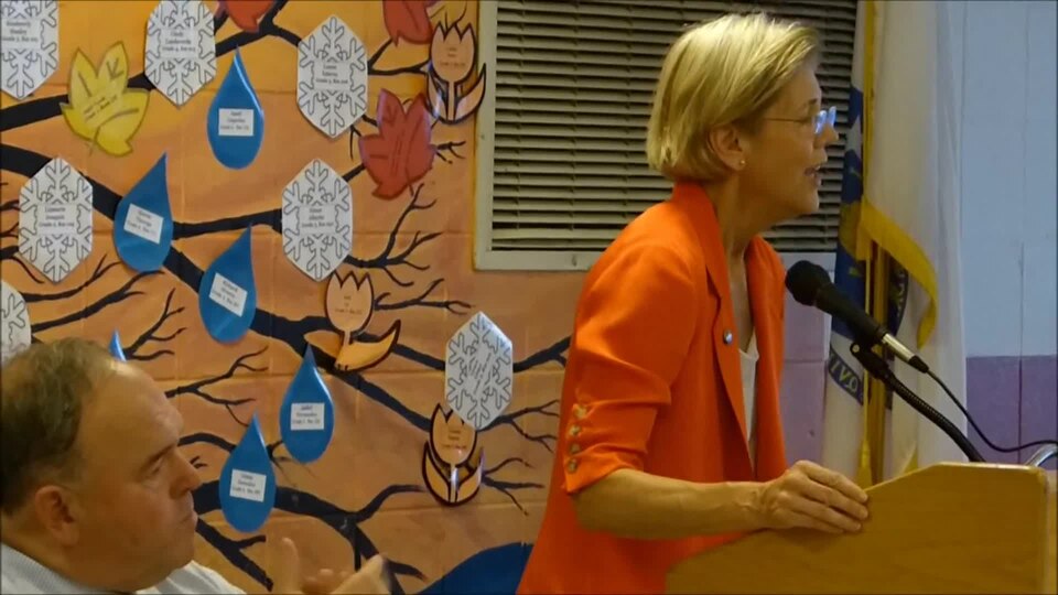 Elizabeth Warren is introduced by John Walsh, chair of the Massachusetts Democratic Party Steering Committee (DSC) at the meeting where the DSC  elects the 11 people who will represent the Bay State in the Electoral College. (These are the people who actually vote for president.) Under its bylaws, t