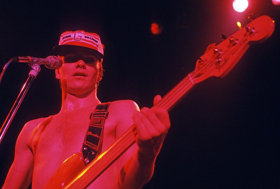 Sting at the Police concert at the Agora Ballroom, Atlanta, Georgia in 1979. Late in the concert a fan gave him a Georgia Bulldogs hat. Scanned Ektachrome slide.