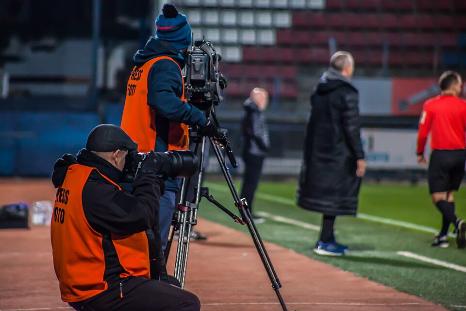 Sports photographer and cinematographer at football match SK Sigma Olomouc-FC Fastav ZLín (2.1),  Ander's stadium, Olomouc, Olomouc District, Czechia