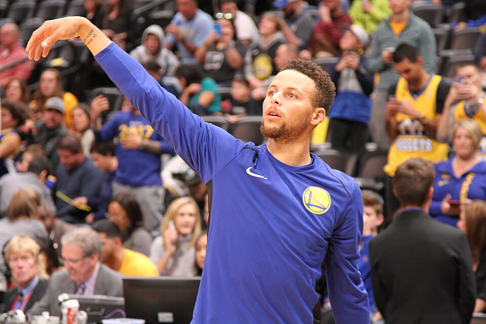 Stephen Curry practices prior to the start of a game in Denver, Colorado.