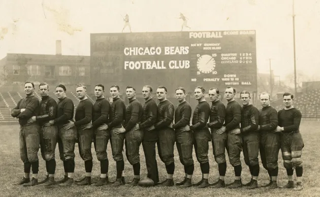 The Chicago Bears team of 1924. From left are: Ralph Scott, Oscar Knop, George Trafton, Ed Healey, Jim McMillen, Vern Miller, Hugh Blacklock, Frank Hanny, Joe LeFleur, Ralph Lanum, Roy White, George Halas, Hunk Anderson, Larry Walquist, Ed Sternaman, and Joe Sternaman.