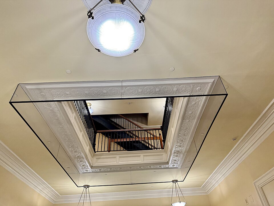 Built in 1829-1832, this Classical Revival-style building was originally designed by Charles Bullfinch as a smaller structure, and was heavily renovated in 1890-1891 and 1909-1910, with the latter being carried out under the direction of G. Henri Desmond, removing most of the original structure and