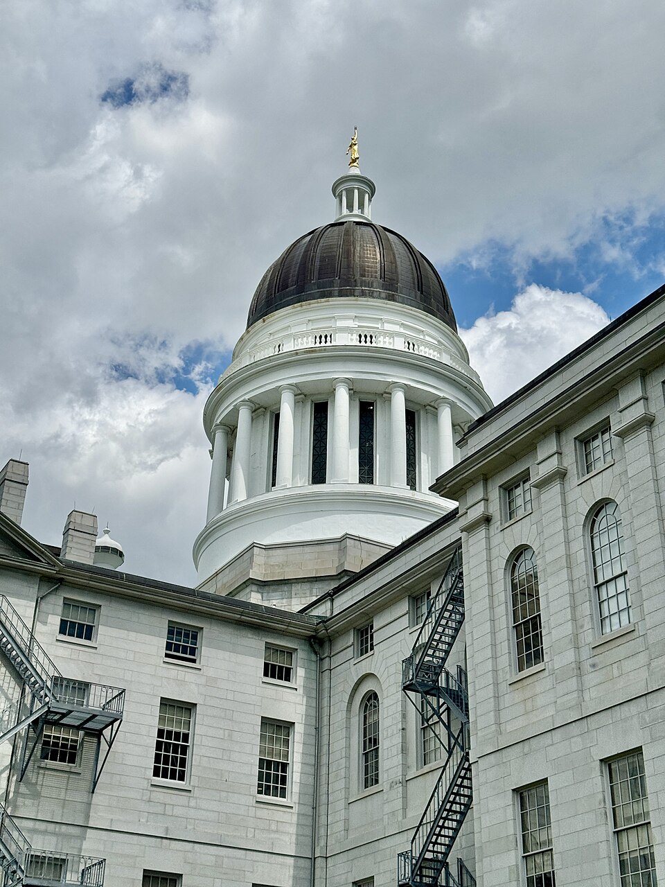 Built in 1829-1832, this Classical Revival-style building was originally designed by Charles Bullfinch as a smaller structure, and was heavily renovated in 1890-1891 and 1909-1910, with the latter being carried out under the direction of G. Henri Desmond, removing most of the original structure and