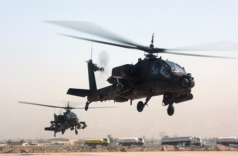 Two U.S. Army AH-64 Apache helicopters take off from Camp Victory, Baghdad Province, Iraq, on March 13, 2007, during Operation Iraqi Freedom. (U.S. Army photo by Sgt. Tierney P. Nowland) (Released)