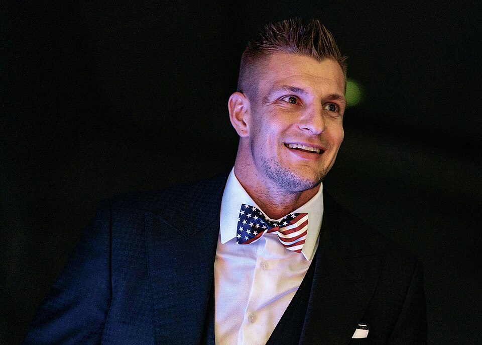 Former NFL player Rob Gronkowski prepares to make remarks on stage during the USO-Metro 38th Annual Awards Dinner at the Ritz-Carlton in Washington D.C., March 10, 2020. Army Gen. Mark A. Milley, chairman of the Joint Chiefs of Staff, and Senior Enlisted Advisor to the Chairman (SEAC) Ramon "CZ" Col