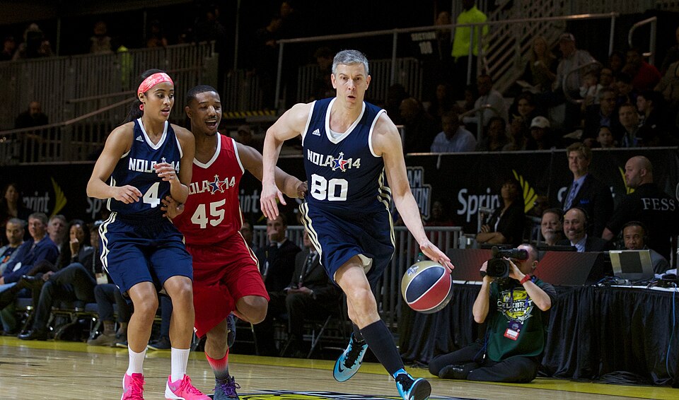 Arne Duncan at the 2014 NBA Celebrity All Star game. Skylar Diggins (4) and Michael B. Jordan also pictured.