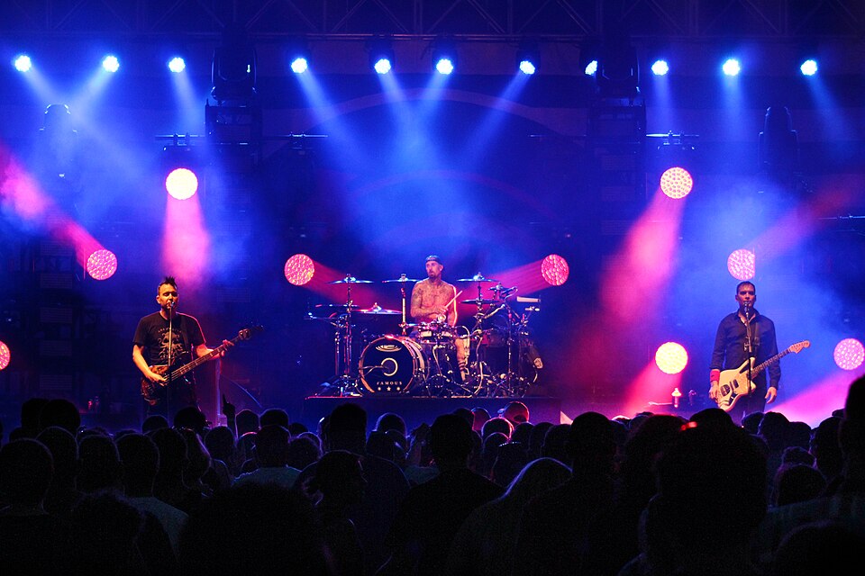 Blink-182 performing at the Innsbrook Pravilion as a part of XL102's Big Field Day in Richmond, Virginia on June 18, 2016. From left to right: Mark Hoppus, Travis Barker, and Matt Skiba.