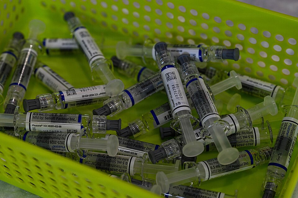 Vials of flu vaccines sit in a container during the 2025 influenza vaccine drive at Aviano Air Base, Italy, Nov. 4, 2025. The drive ensures widespread immunization against the influenza virus, which can pose significant risks to both individual health and mission readiness. (U.S. Air Force photo by
