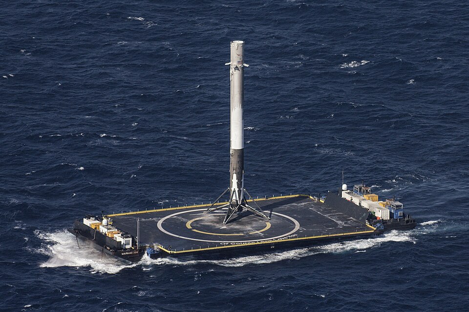 First stage of a Falcon 9 Full Thrust rocket on the autonomous spaceport drone ship (ASDS) Of Course I Still Love You. The stage landed successfully after launching the SpaceX CRS-8 resupply mission to the ISS. According to SpaceX, the photograph was taken from a NASA chase plane.