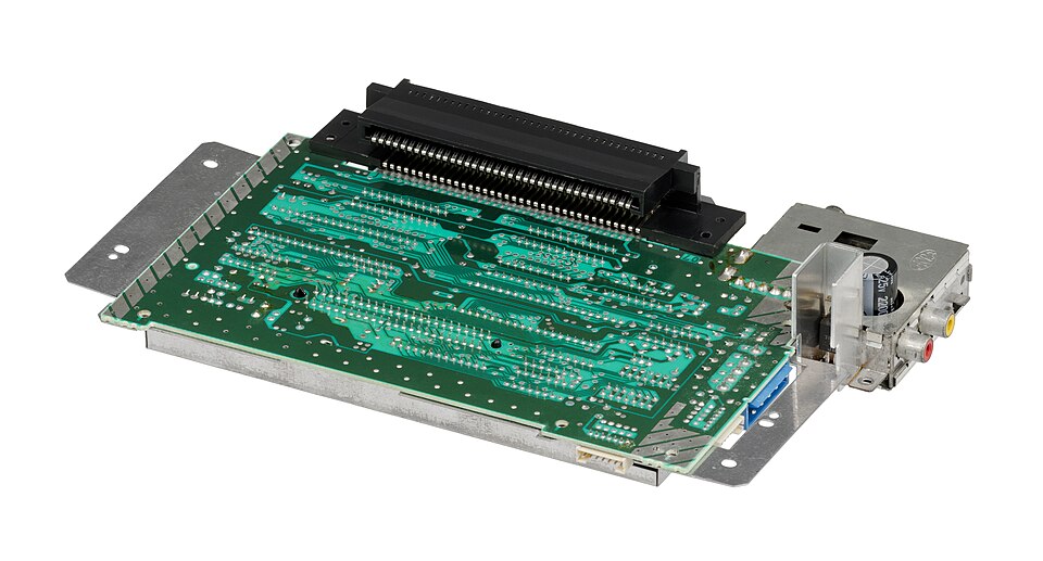 The underside of the motherboard of the Nintendo Entertainment System video game console, also known as the NES. This is the unpopulated side of the board that you would see facing up if taking apart the system and removing the cartridge-loading mechanism.
