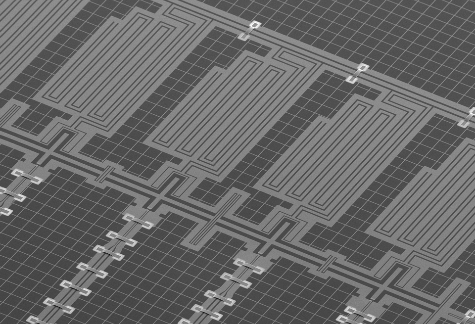 SEM image of 11 superconducting qubits chip. The qubits are connected in a chain to form a new type of quantum simulator. Here, you can consider the key architectural elements of superconducting devices as transmon qubits based on sub-100nm Josephson Junctions, microwave coplanar resonators, and sup