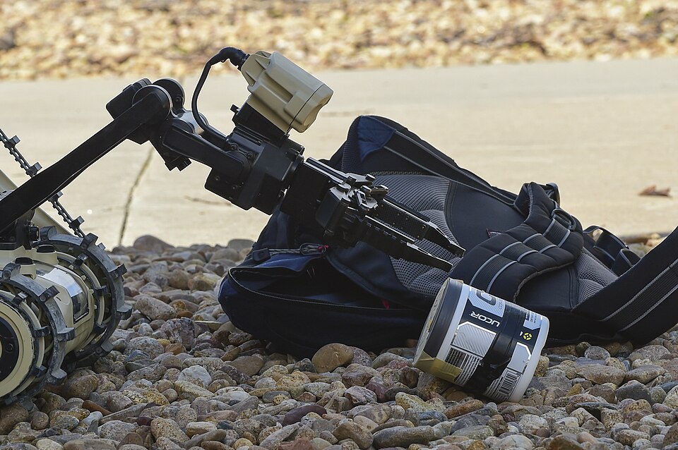 A micro tactical ground robot removes a “bomb” in the restricted area during Exercise Panther View 18-3 July 24, 2018, on Buckley Air Force Base, Colorado. The MTGR is an all-terrain, stair climbing tactical robot used by the 140th Civil Engineer Squadron explosive ordnance disposal operators. (U.S.