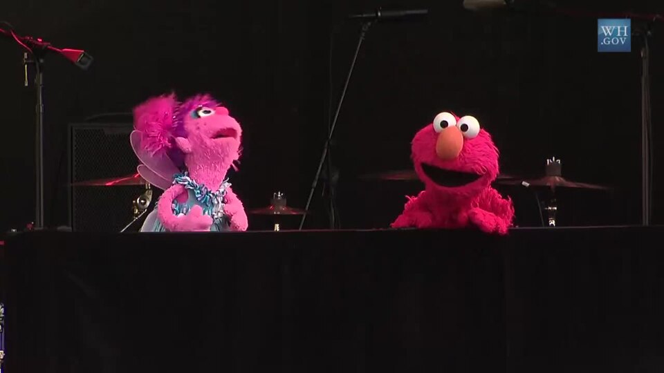 Gordon, Abby, and Elmo from Sesame Street perform on the Rock 'n' Egg Roll Stage at the 2012 White House Easter Egg Roll.
