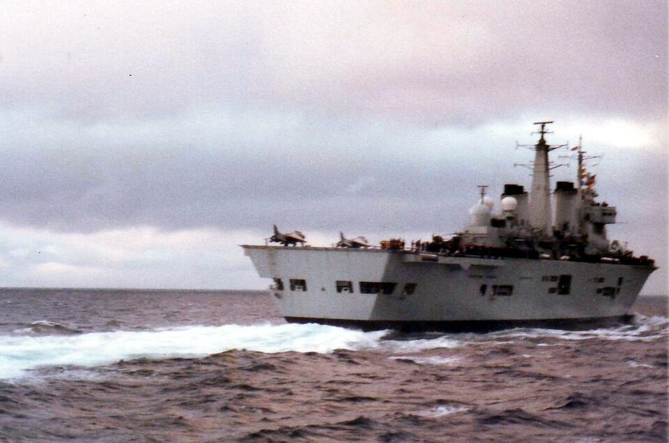 HMS Invincible in the Total Exclusion Zone 1982. Although the pictures were taken with a zoom lens and are of poor quality, the starboard side seen here is undamaged.
