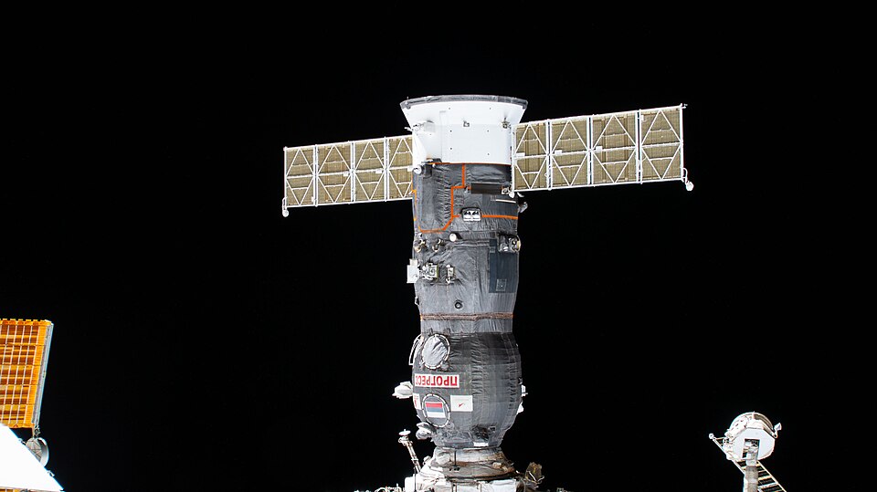 iss073e0424353 (Aug. 7, 2025) --- The Progress 92 cargo craft is pictured docked to the International Space Station one month after docking to the Poisk module and delivering about three tons of food, fuel, and supplies for the Expedition 73 crew.