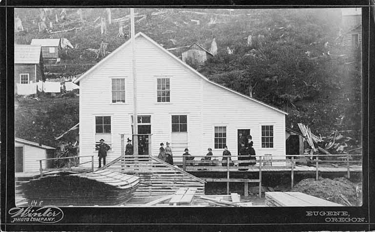 Handwritten on image: 148
Caption on mount: Winter Photo Company. Eugene, Oregon. 

Handwritten on verso: Juneau the first Court House at foot of Rawn Way. 

PH Coll 334 Winter.5
The Winter Photo Company was first located in Eugene, Oregon and was operated by Clarence L. Winter and Sue Dorris in 189